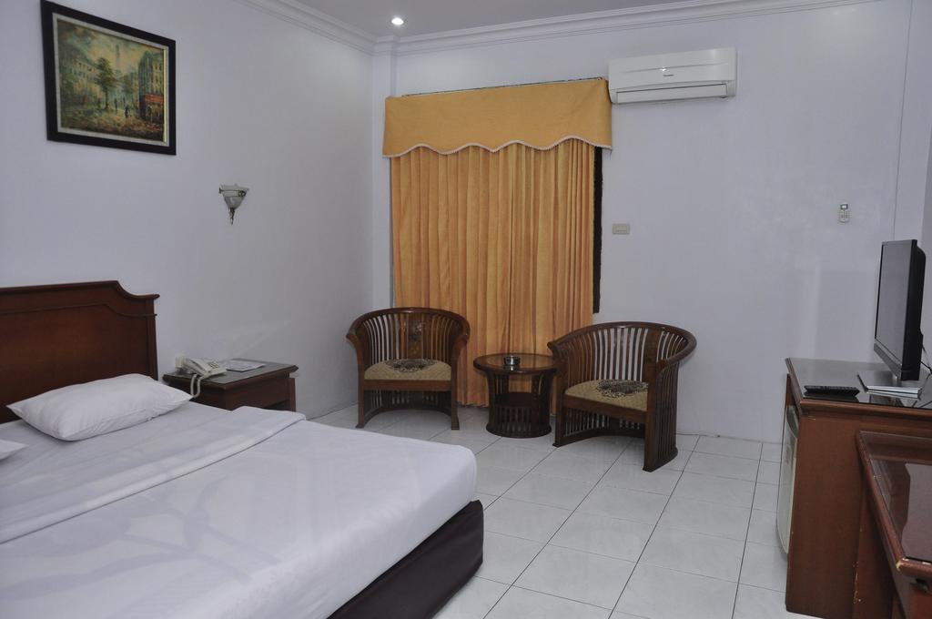 Hotel Andhika Syariah Samarinda Quarto foto